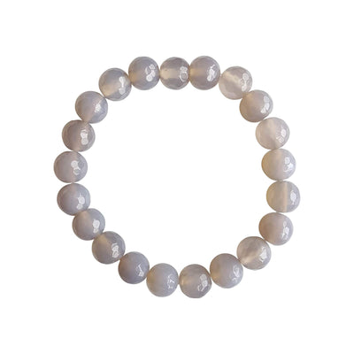 A close up image on a white background of a lavender agate gemstone stretch bracelet made with faceted 8mm beads.